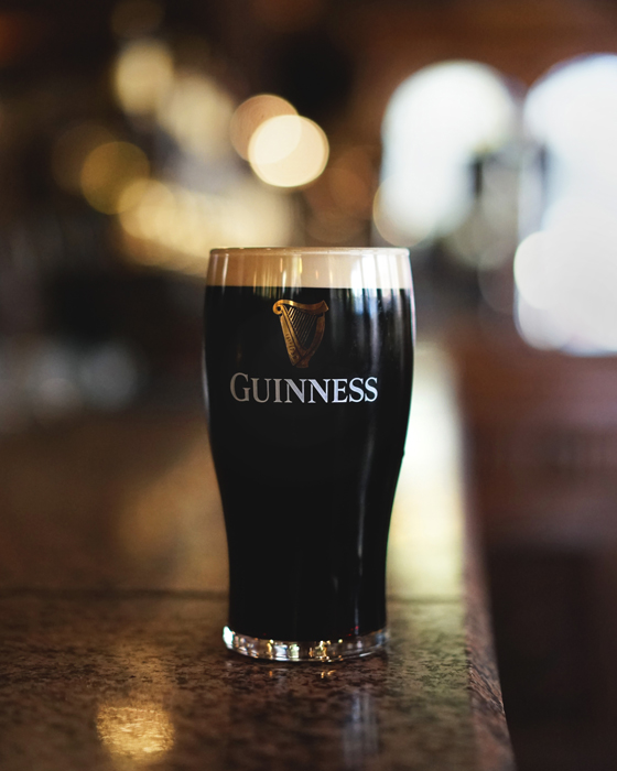 Guinness glass with a full pint